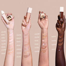 Several arms of various skin undertones displaying swatches of Lancôme Teint Idôle Ultra Wear Care & Glow Foundation