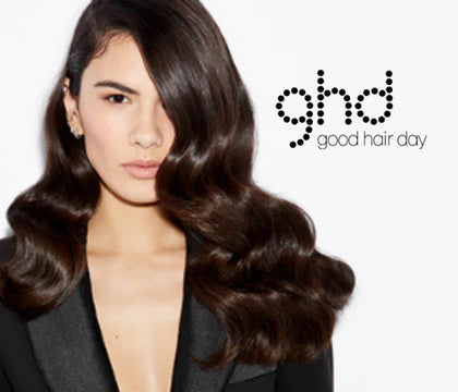 Girl with beachy brunette waves alongside the GHD brand logo 