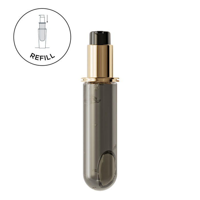 Refillable spray bottle with gold cap on a white background